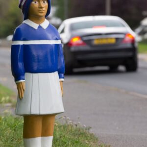 billy bollard on side of road near school