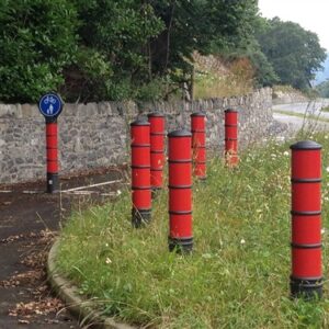 red plastic bollards on pathway