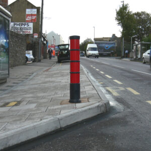 red plastic bollard on path